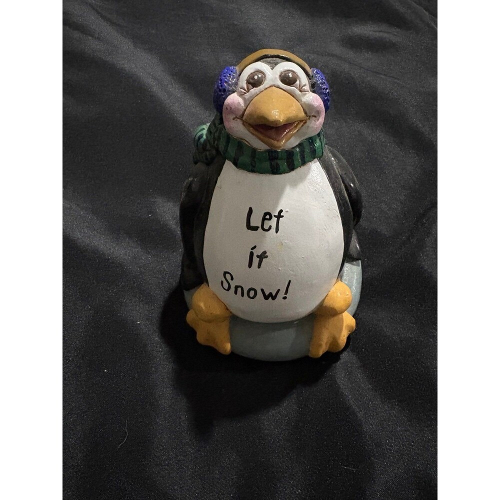 Enesco  ceramic penguin figurine features a "Let it Snow!" 2000